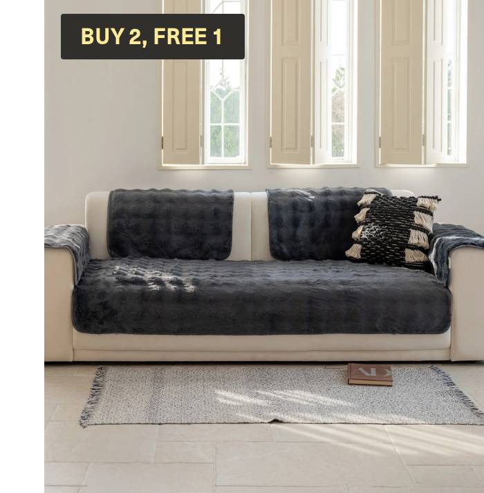 Magic Sofa Mat in gray on a sofa, with 'Buy 2, Free 1' badge